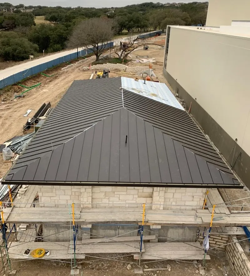Metal roof new construction with scaffolding in Idylwood